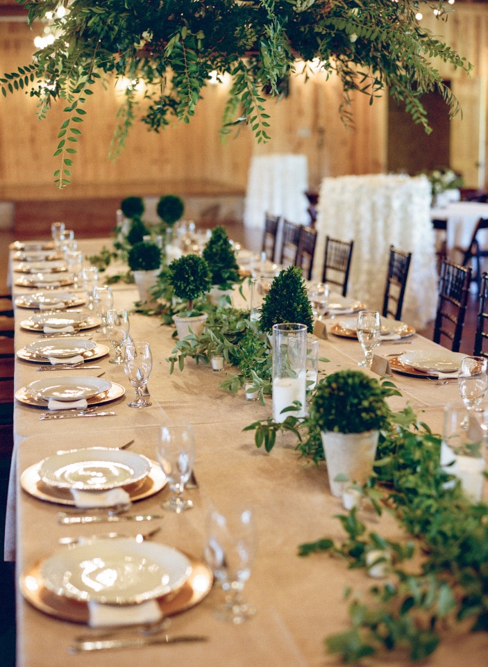 Elegant wedding table setting with greenery and floral decor