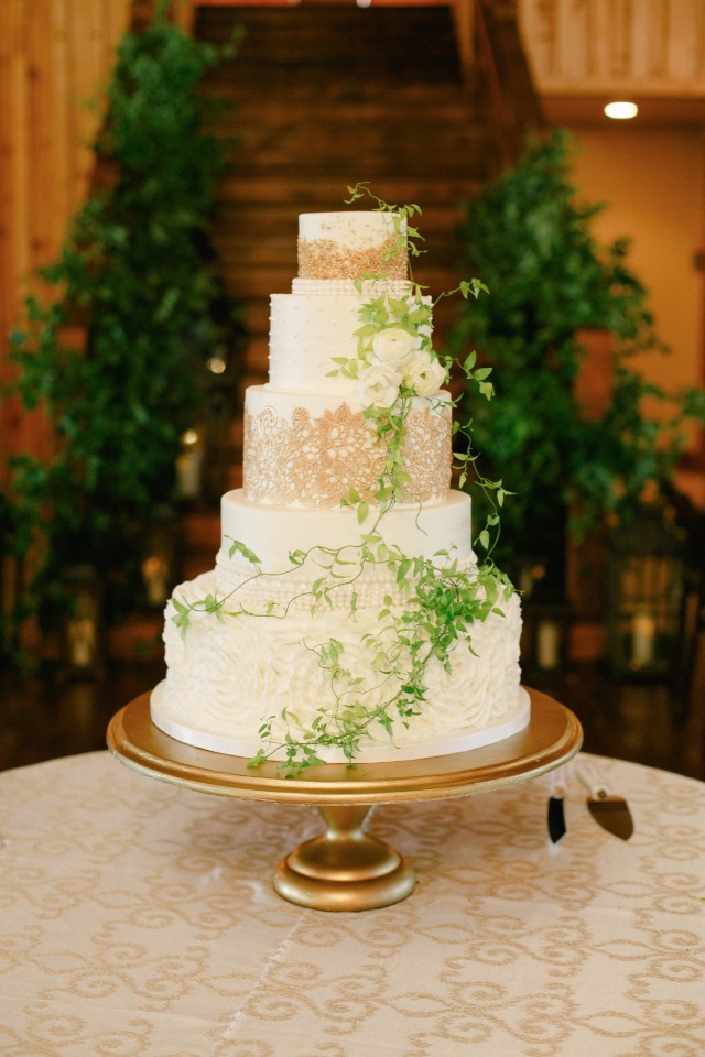 Elegant wedding cake with floral decorations and gold accents