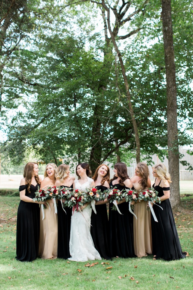 Bridesmaids in gold and black dresses