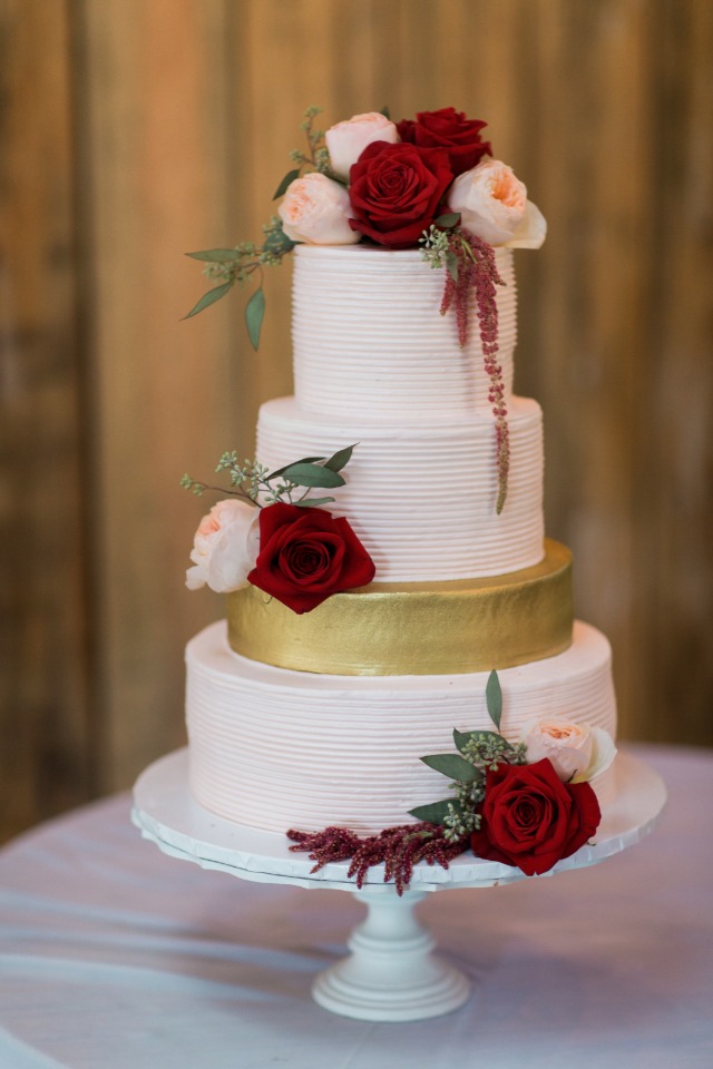 Red blush and gold wedding cake