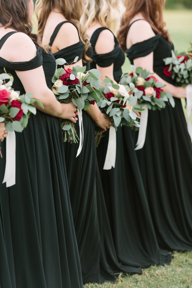 Bridesmaid in black and gold dresses