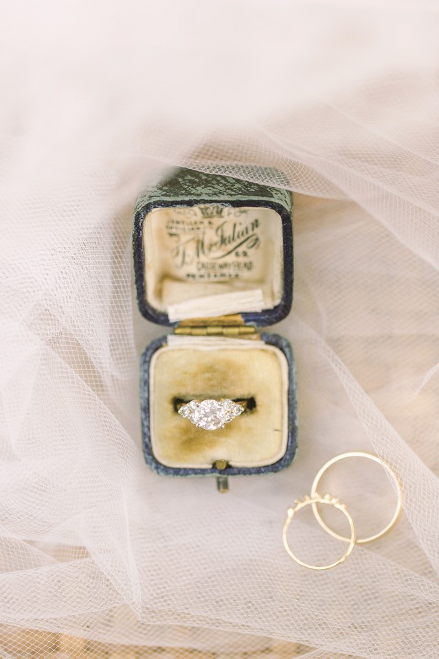 Vintage engagement ring in velvet box with wedding bands