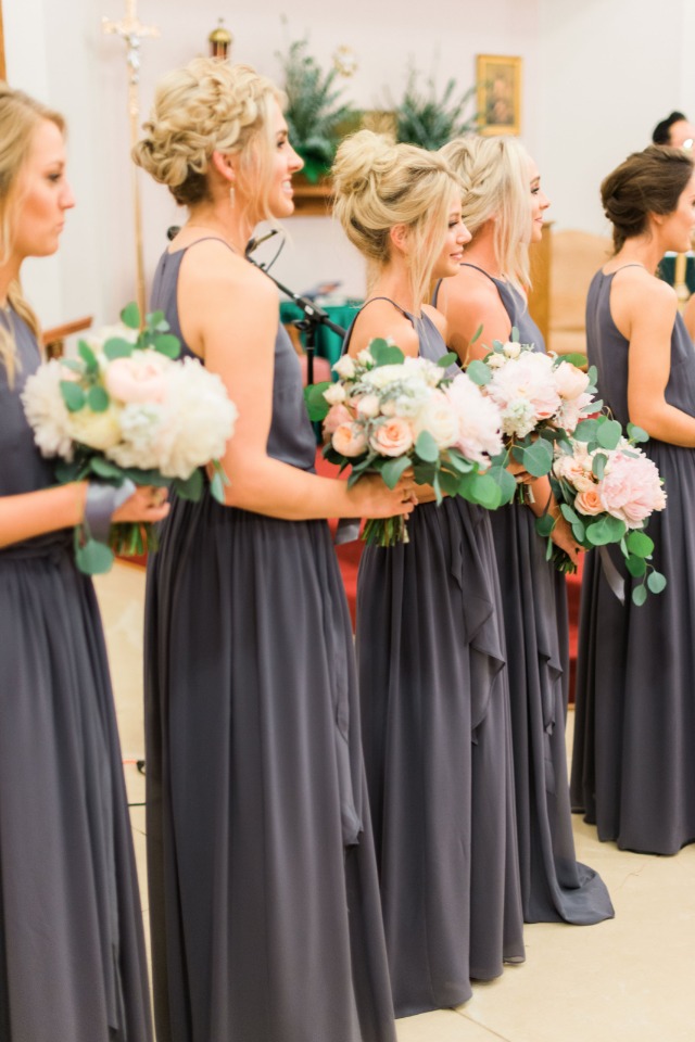 charcoal gray bridesmaids with white and peach bouquets
