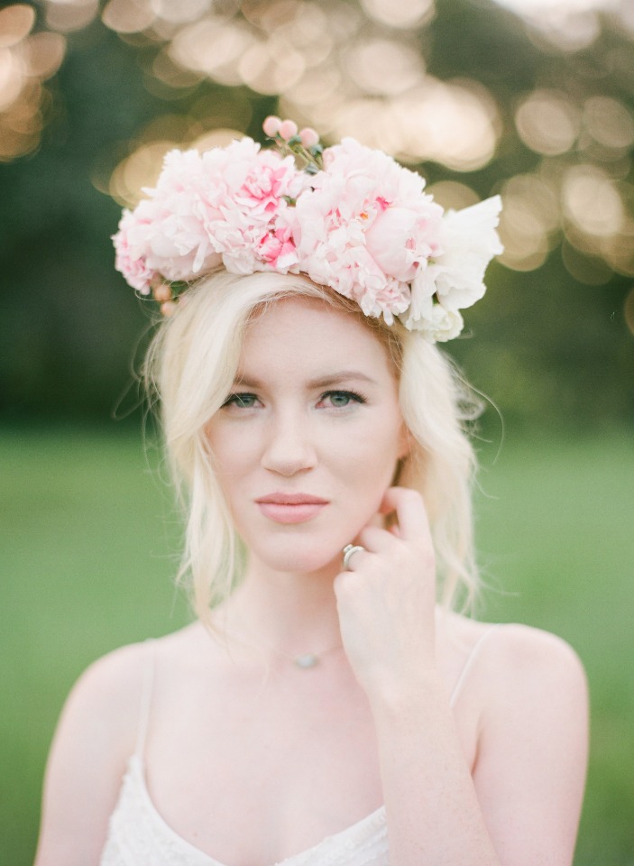 Blonde woman wearing a floral crown, soft and beautiful portrait