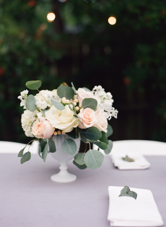 Elegant floral centerpiece on a table setting for a wedding