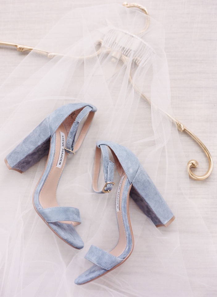 Light blue Steve Madden heels and bridal veil on hanger