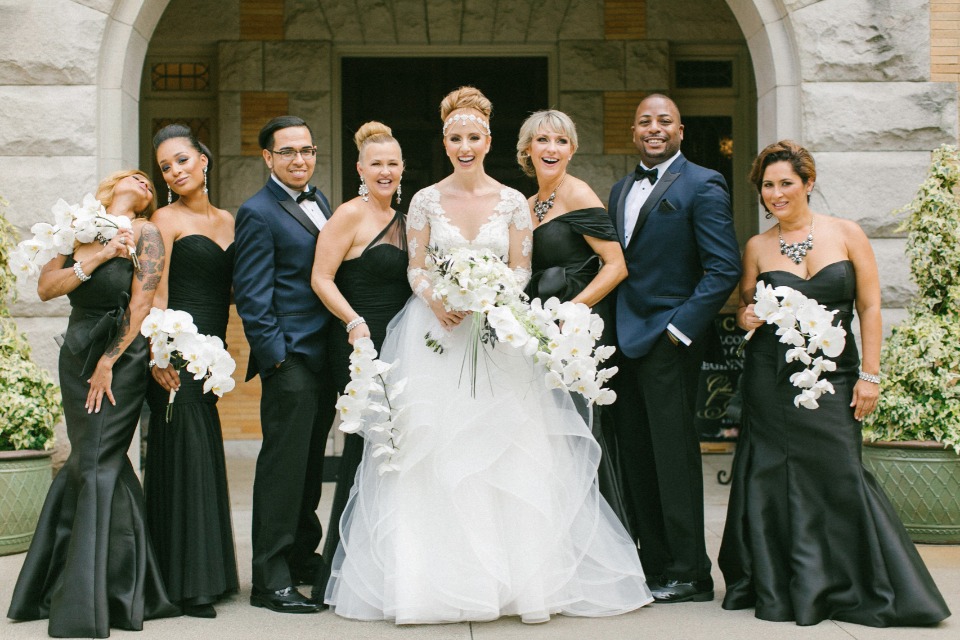 Bridal party in black gowns and navy suits