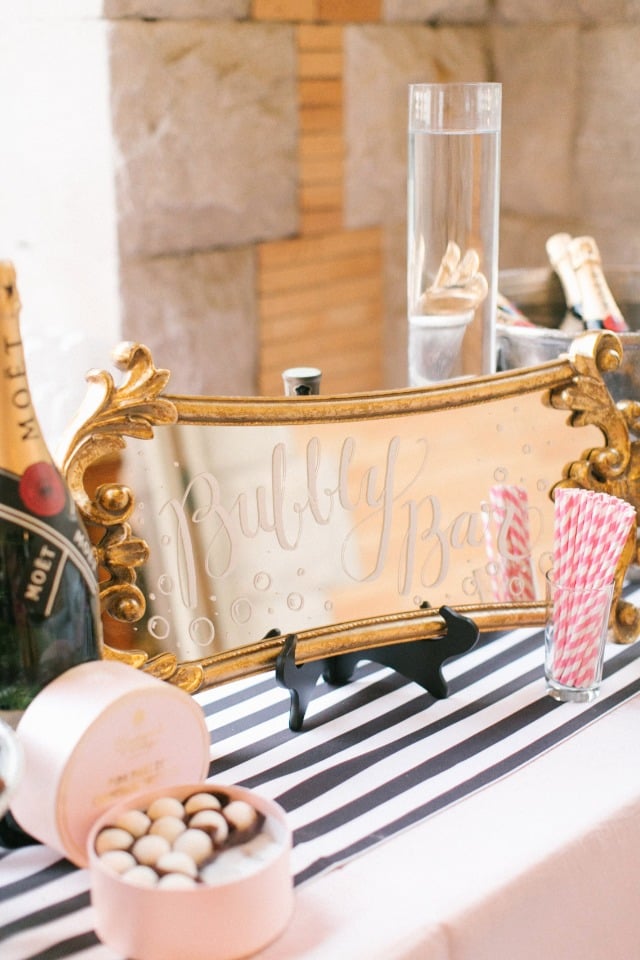 We love this gold bubbly bar mirror sign