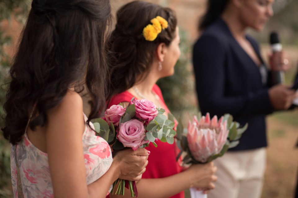 bridesmaids with mismatched bouquets and dresses