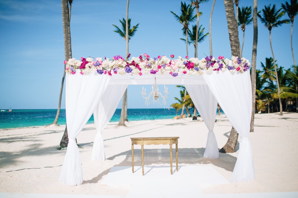 white and pink beach ceremony