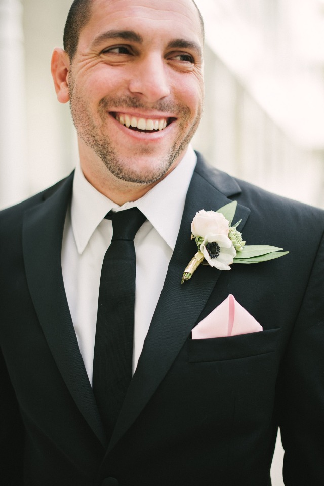 classic black suit groom style