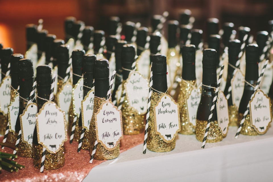 gold glitter mini champagne bottle escort cards
