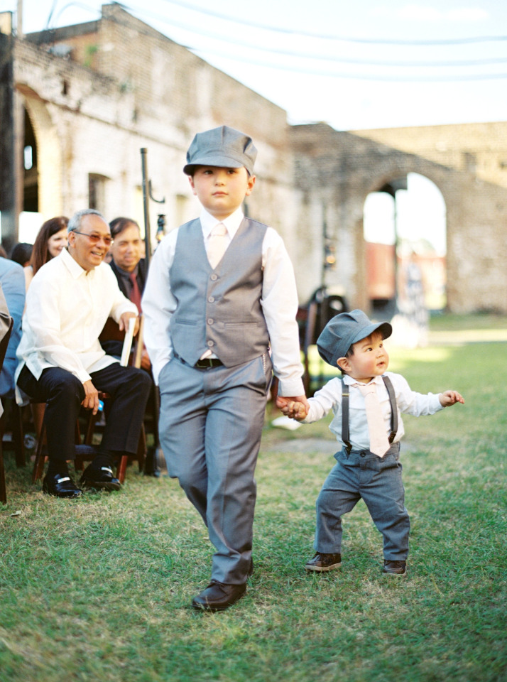 cute ring bearers with train conductor hats