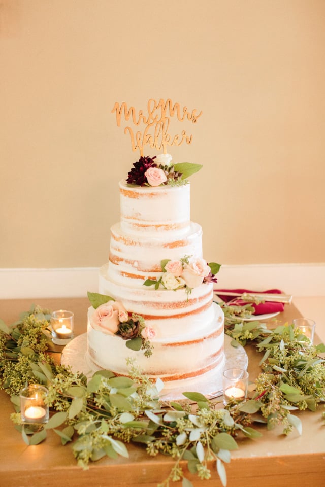 semi naked wedding cake with flowers