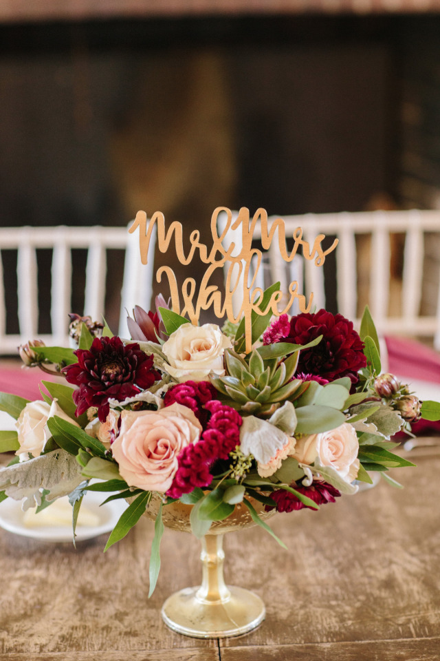 pink and red wedding centerpiece with succulents