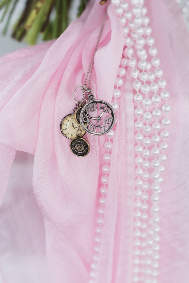 bouquet sash with strings of pearls and pocket watches