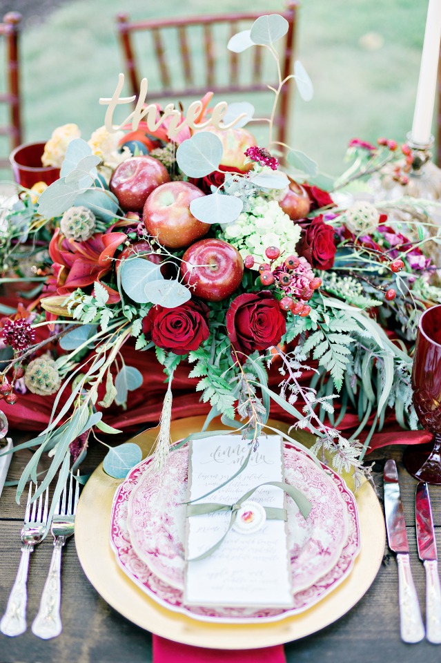 red and gold apple picking inspired centerpiece