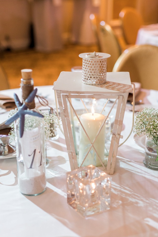 lantern and message in a bottle beach table decor