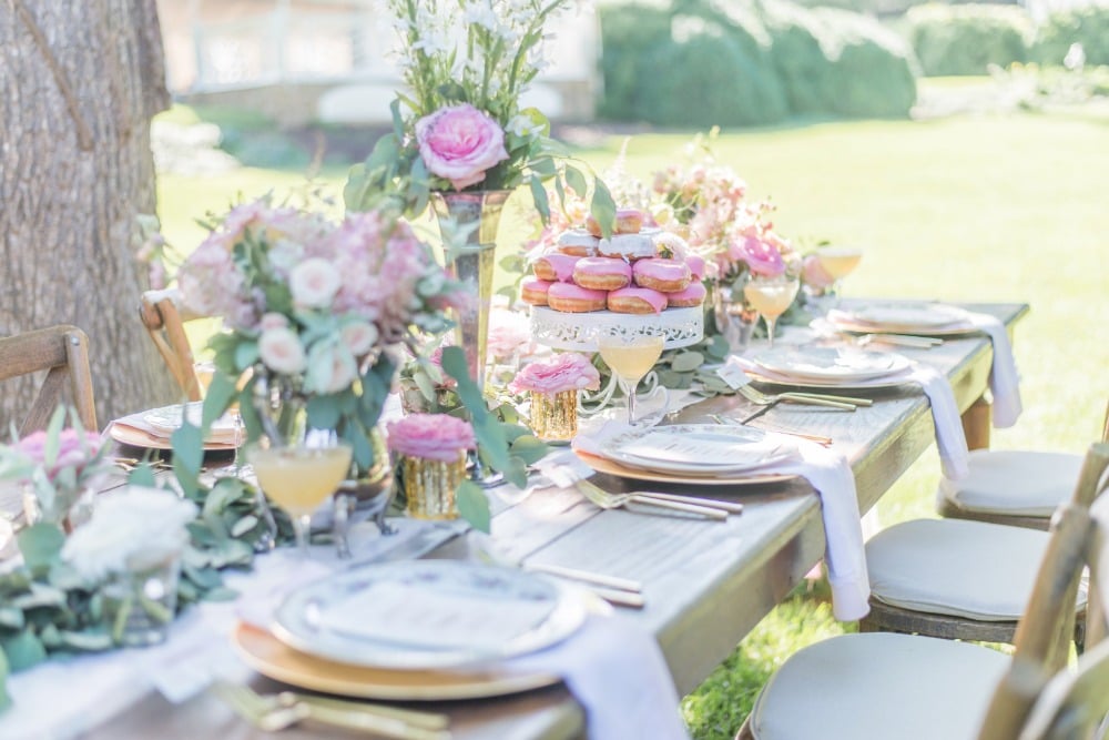 Beautiful reception table with pink florals