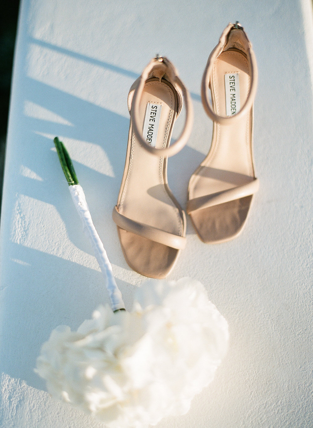 nude wedding shoes and white bouquet