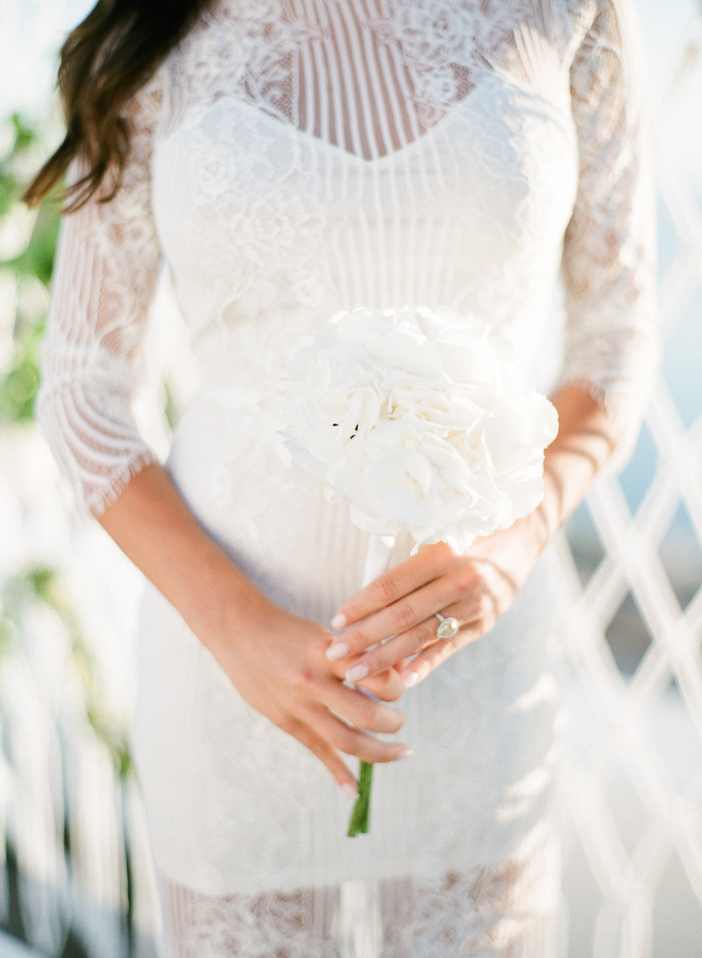white engagement dress with hydrangea bouquet
