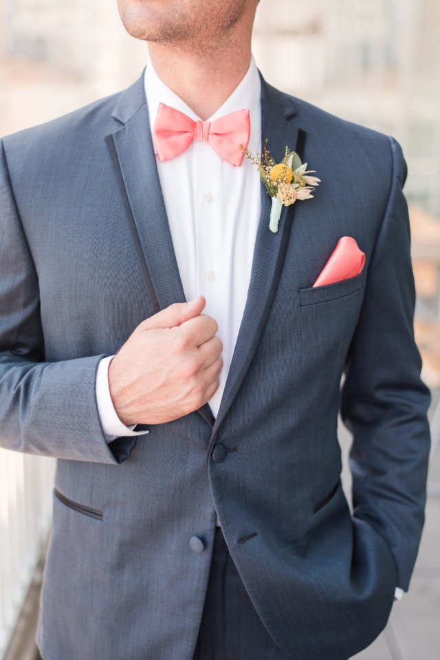 blue wedding suit with pink bow tie and pocket square