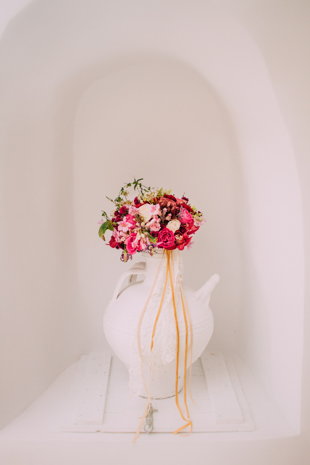 Beautiful pink and red flower bouquet in white pitcher