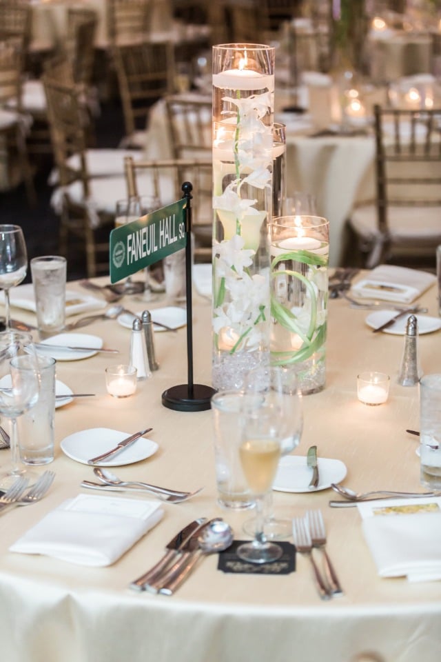 pillar floating candle wedding centerpiece with street sign table name