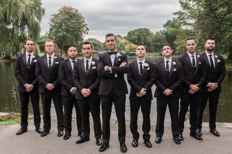 groom and his men in formal black tuxedos