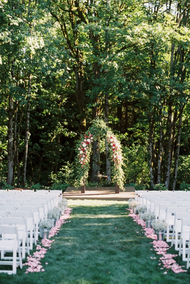Floral filled wedding arbor