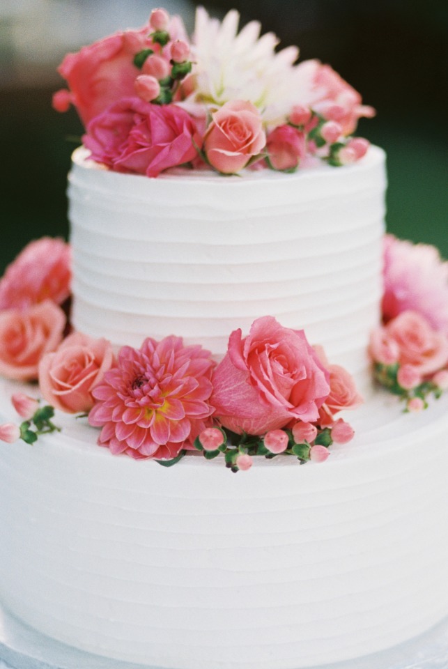 White wedding cake with pink florals