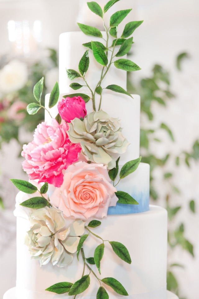 Blue watercolor cake with cascading florals