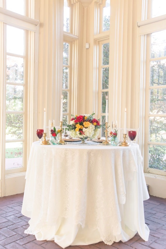 Simple red and gold sweetheart table decor
