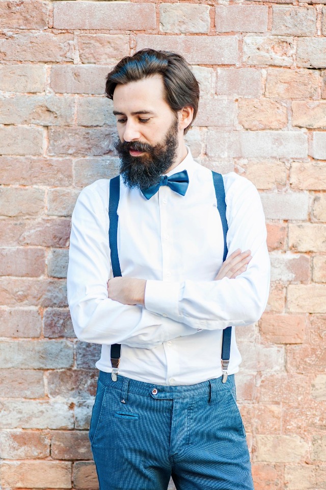 hipster groom in bow tie and suspenders