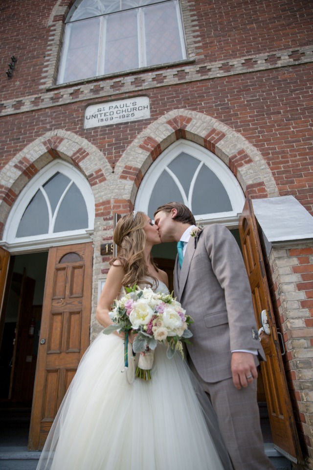 wedding kiss outside the church