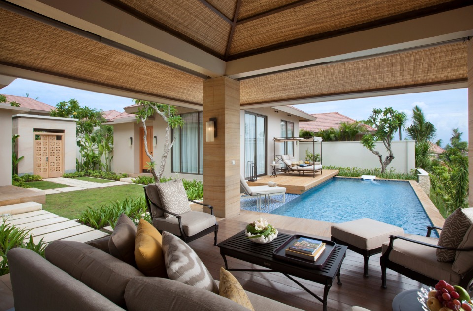 The Mulia Villas private pool and lounge area in Bali