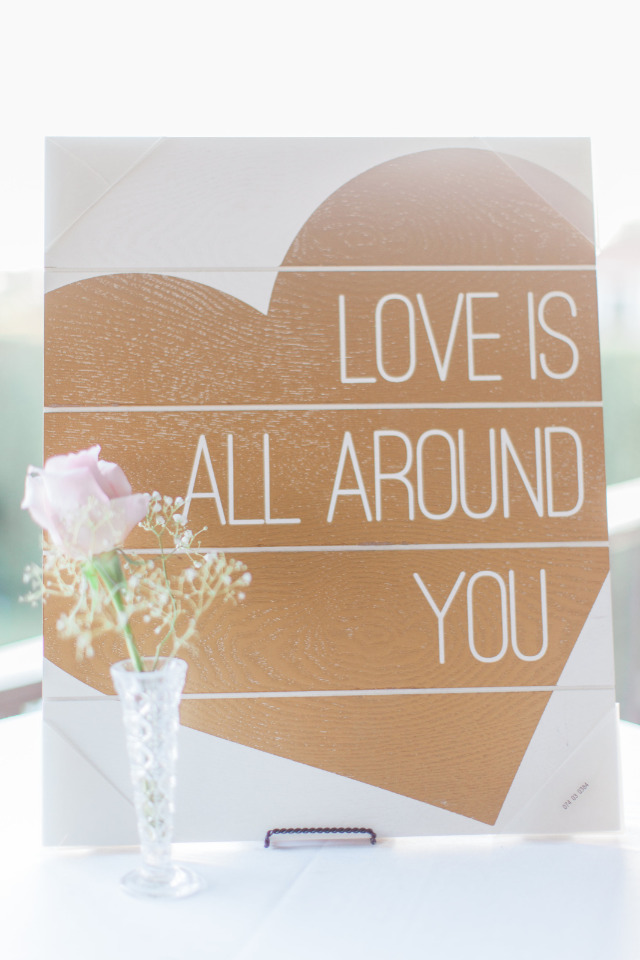 love is all around you wedding sign