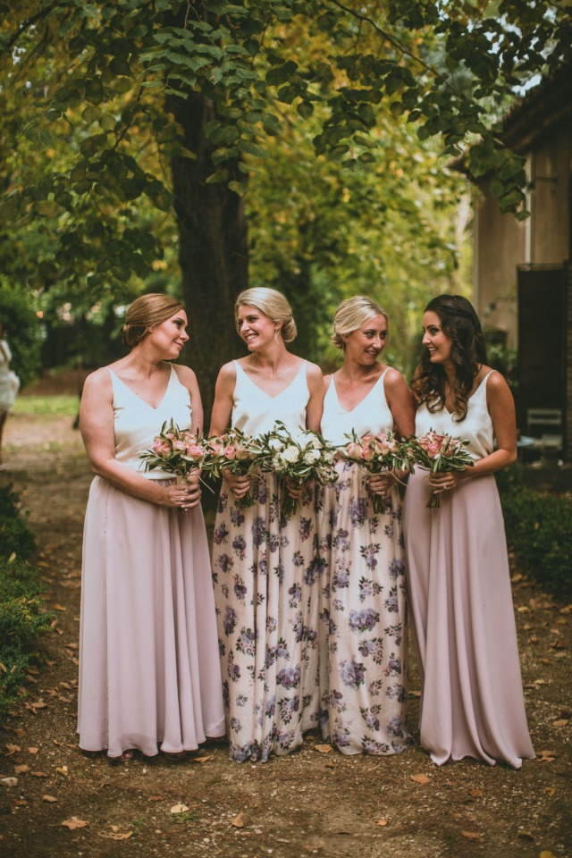 bridesmaids in pink and floral dresses