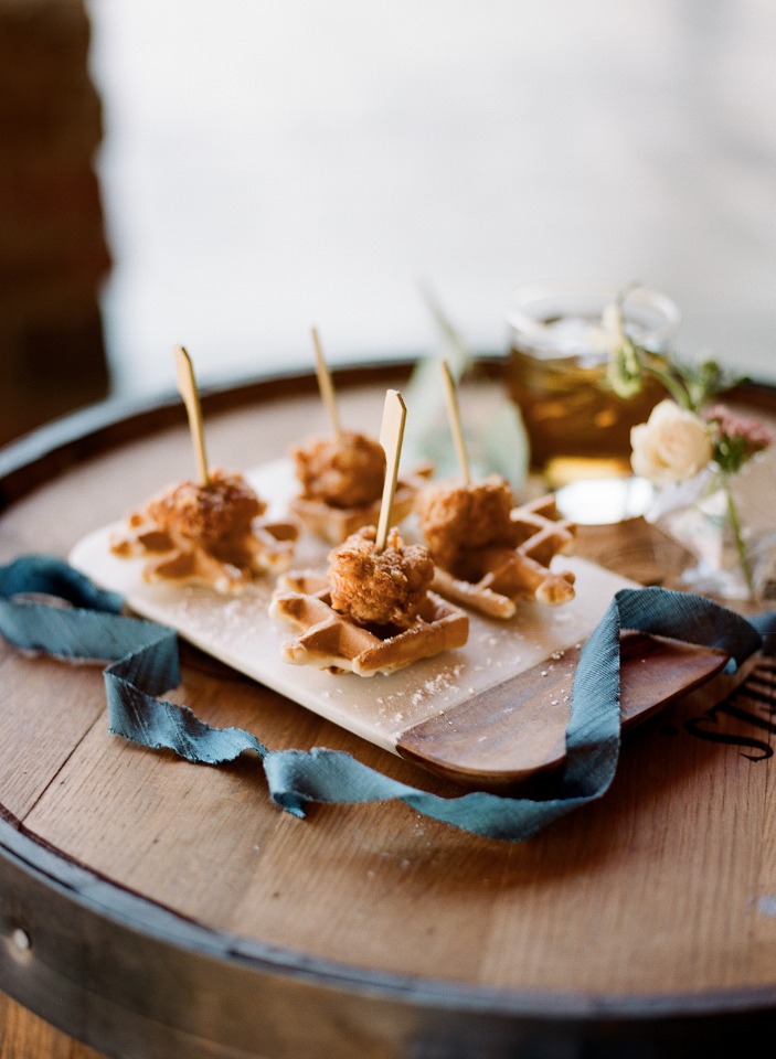 Mini chicken and waffles appetizers on a wood board