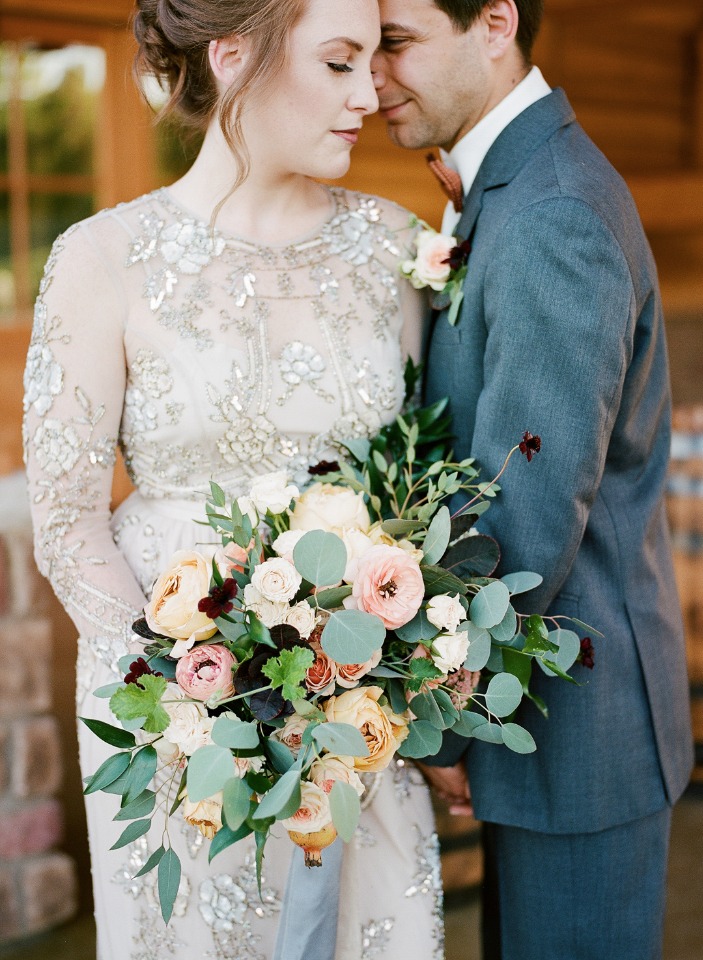 elegant vintage style appliquÃ© overlay wedding dress and romantic bouquet