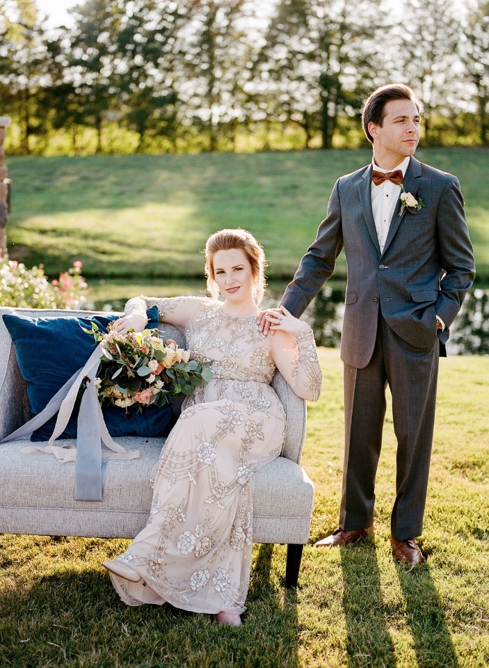 Elegant bride and groom pose outdoors on their wedding day