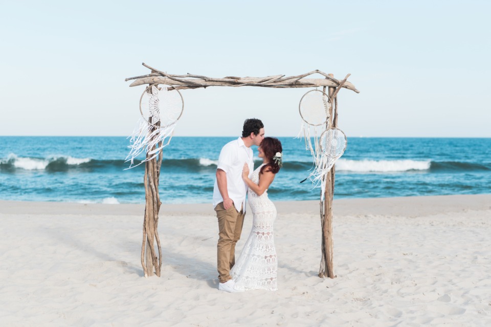 Gorgeous driftwood arbor with dream catchers
