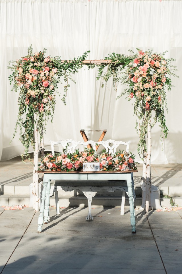 Use your wedding arbor for your sweetheart table backdrop