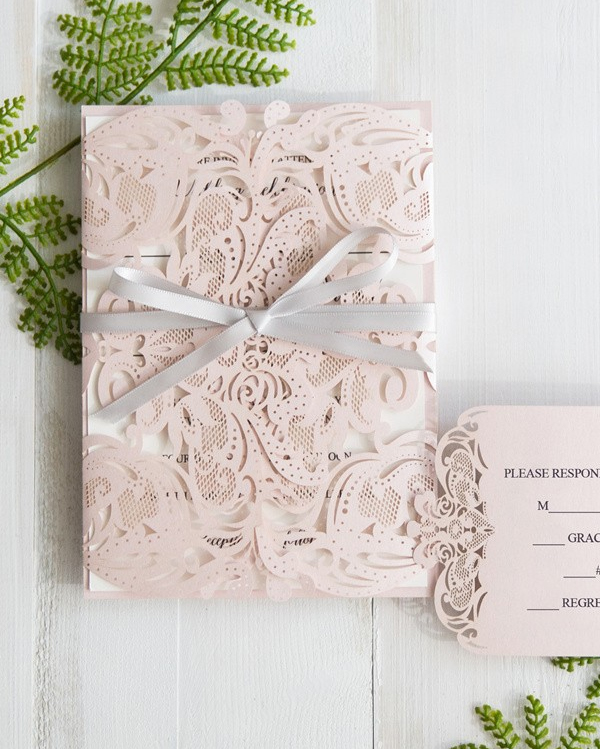 Pink laser cut wedding invites from Stylish Wedd