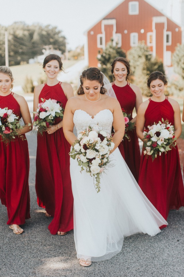 bridesmaids in full length red dresses