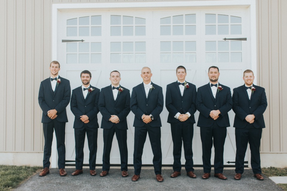 groom and his men in classic navy suits