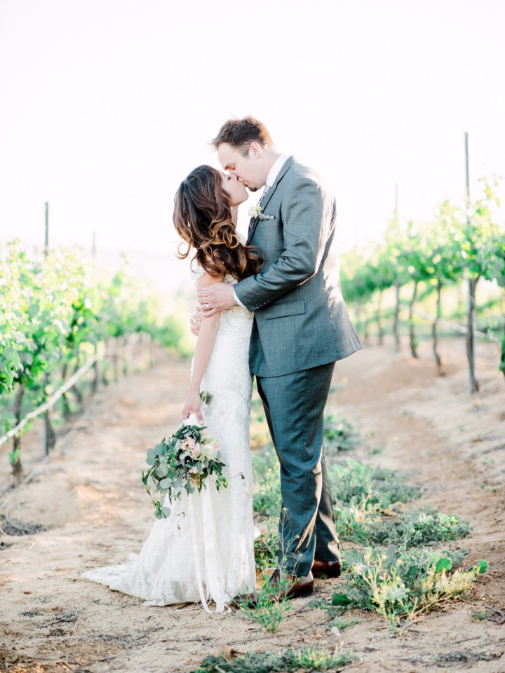 romantic vineyard wedding kiss