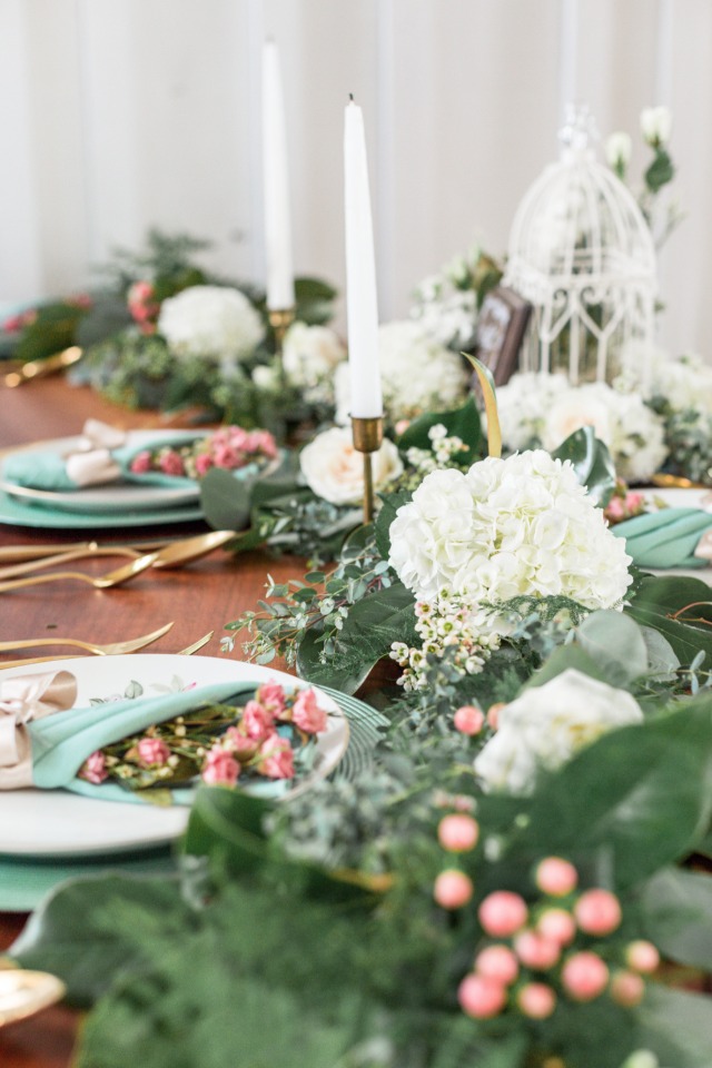 white pink and dark green wedding table