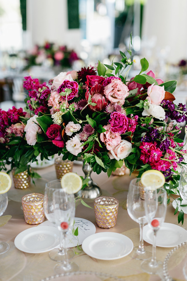 vibrant pink wedding centerpiece with protea