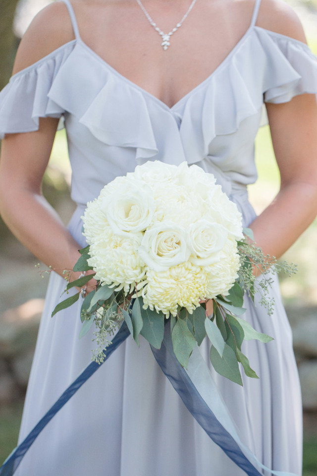 dusty blue bridesmaid dress with white bouquet